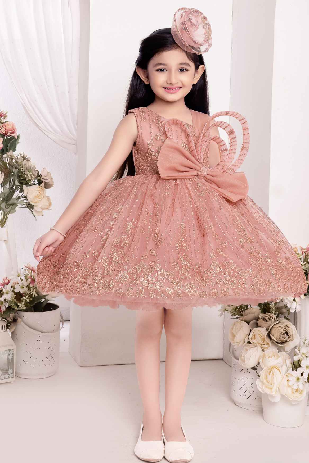 Onion Pink Frock With Bow Embellished And Shimmer Printed For Girls