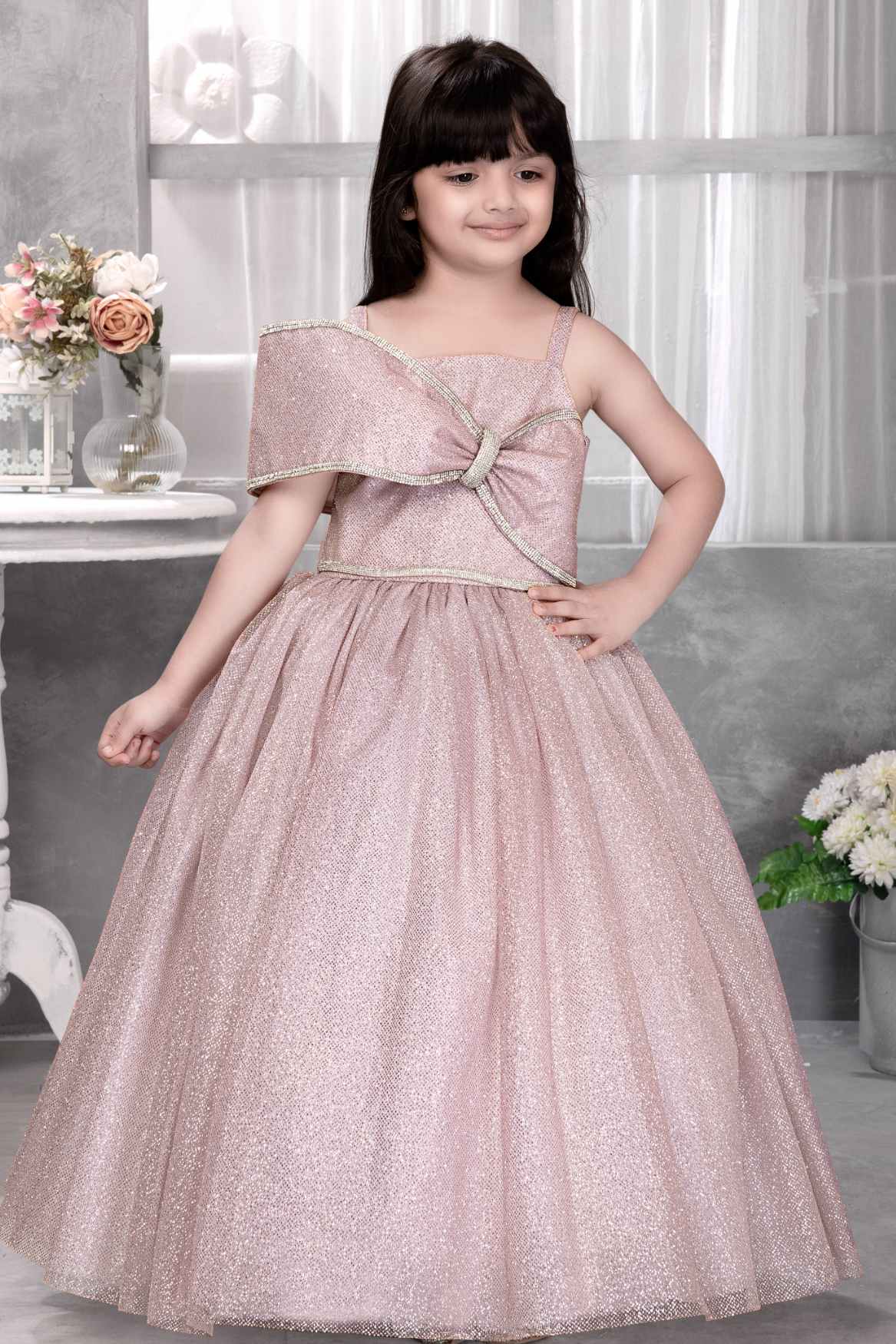 Onion Pink Sleeveless And Bow Embellishment With Stone Worked Gown For Girls